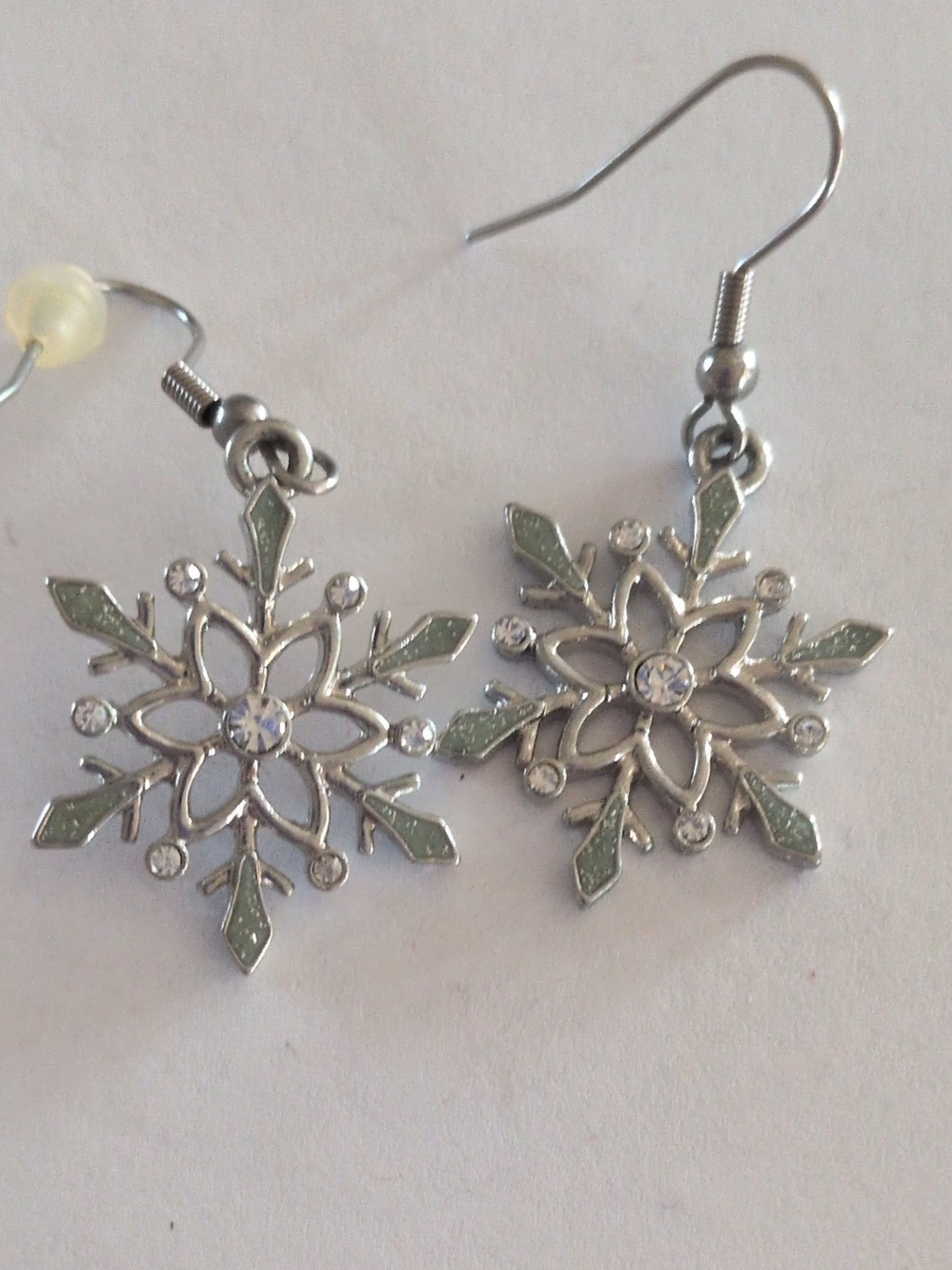 Silver Snowflake Dangle Earrings with Pale Green Accents